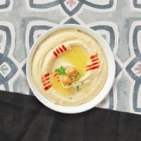 Hummus Me Appetizer · A mixture of mashed garbanzo beans, lemon juice and tahini, and garlic served with pita bread.