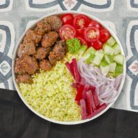 Mary'S Lamb Kebab Bowl · Yellow rice, Jerusalem salad topped with grilled spicy lamb kebobs dressed with tahini sauce.