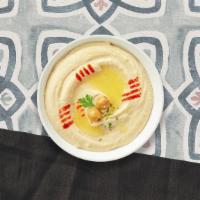 Hummus Me · A mixture of mashed garbanzo beans, lemon juice and tahini, and garlic served with pita bread.