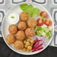 I Fell Falafel · Baked and fried mixture of garbanzo beans, fava beans, coriander, cumin, parsley and onions....