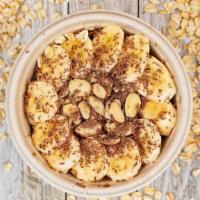 Overnight Oats · 380 cal. Maple syrup, banana, candied almonds & dark chocolate.