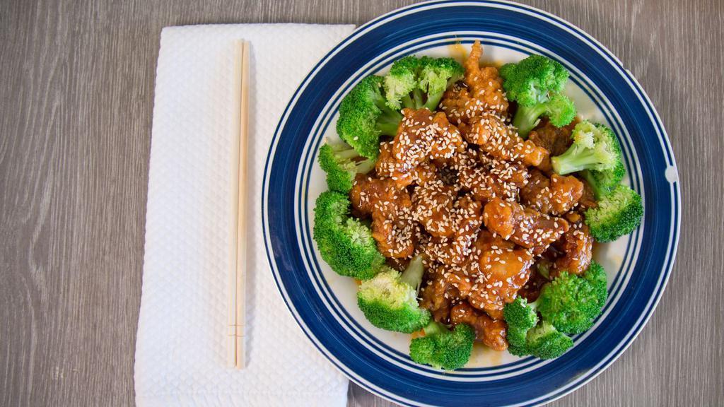 Sesame Chicken · Chunks of fried chicken with sesame sauce. served with broccoli.