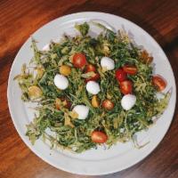 Italia Salad* · arugula, cherry tomato, fresh mozzarella, olive oil, balsamic vinaigrette, parmesan
