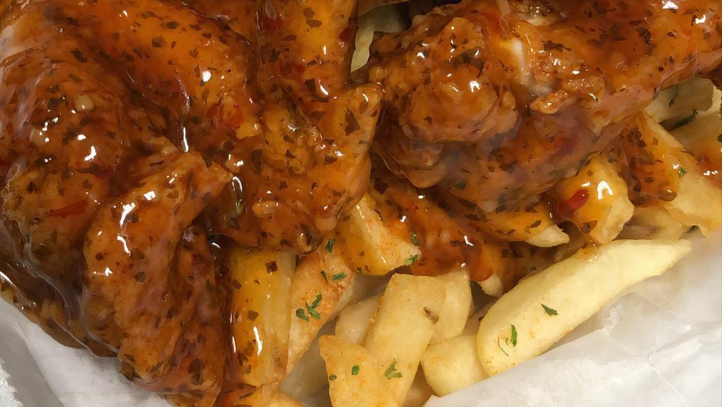 Wing Basket · Wings with french fries.