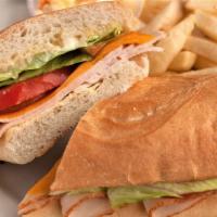 Hot Turkey Hoagie · Turkey thinly sliced and oven baked, topped with lettuce, tomato and mayo. Made with America...