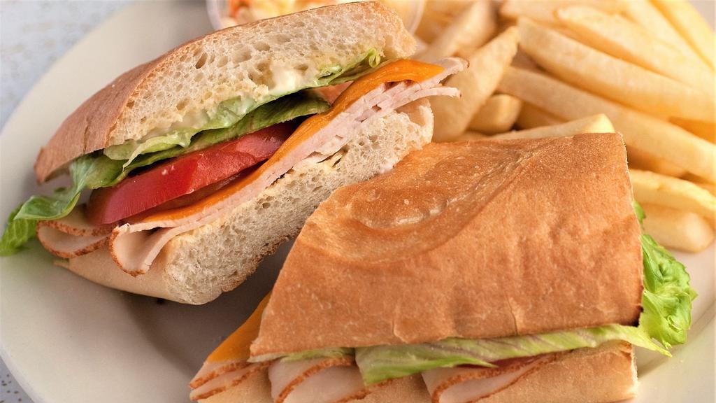 Hot Turkey Hoagie · Turkey thinly sliced and oven baked, topped with lettuce, tomato and mayo. Made with American, Cheddar, Swiss, mozzarella or Pepper Jack cheese.