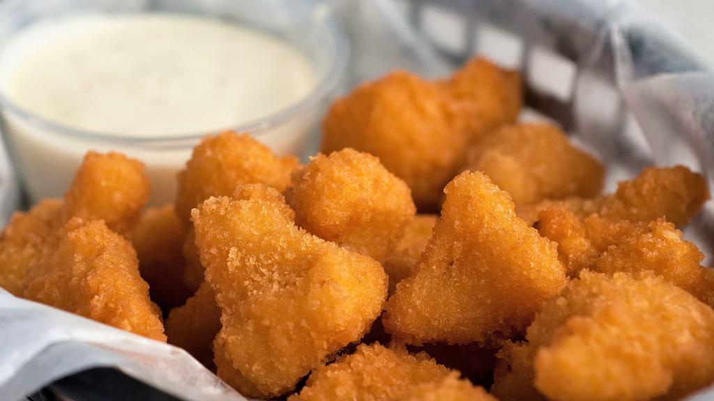 Cauliflower · Breaded and fried cauliflower and Cheddar cheese, served with ranch or sauce of choice.