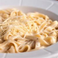 Fettuccine Alfredo · Fettuccine noodles, covered in our garlic alfredo sauce, topped with freshly shredded Parmes...