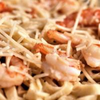 Shrimp Fettuccine · Fettuccine noodles, covered in our garlic alfredo sauce, topped with freshly shredded Parmes...