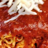 Lasagna · Made with our traditional tower recipe, thick layers of seasoned ground beef and pork, combi...