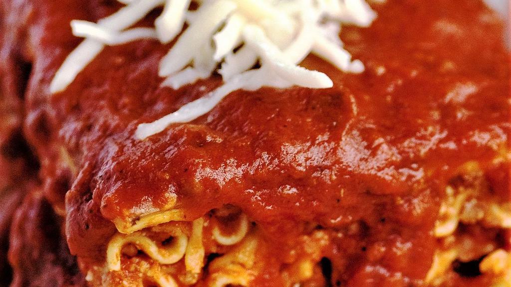 Lasagna · Made with our traditional tower recipe, thick layers of seasoned ground beef and pork, combined with our original sauce, topped with ricotta, Parmesan and mozzarella cheese.