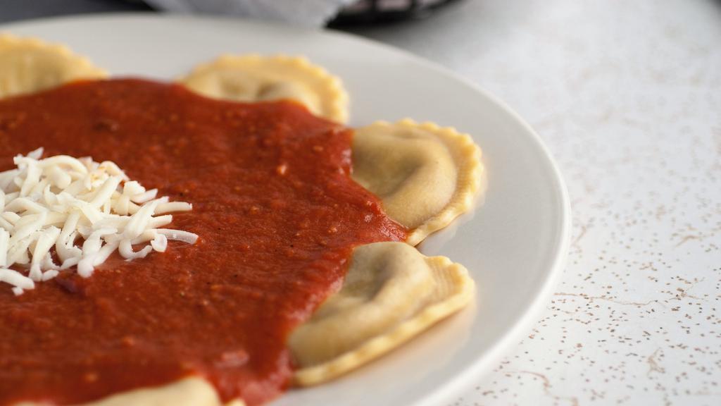 Ravioli · Classic beef ravioli dressed in our signature meat sauce, topped with mozzarella cheese.
