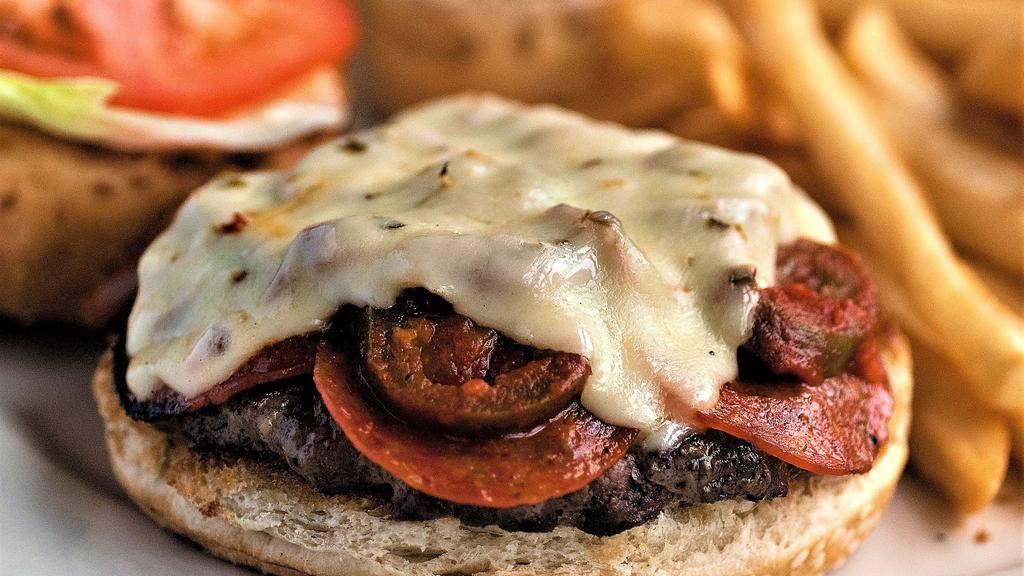 Hot Tower Burger · Layered with pepperoni, green peppers and jalapeños, sautéed in our own spicy pizza sauce, covered with melted Pepper Jack cheese, lettuce and tomato.