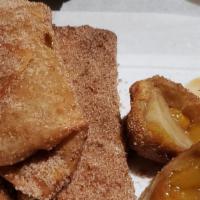 Peach Cobbler Egg Rolls · Try 3 of our homemade deep fried Peach Cobbler egg rolls, dusted with cinnamon and sugar.  A...