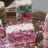 Dipped Rice Crispy Treats  · Oooey Gooey Rice Crispy treats dunked in chocolate and decorated with drizzle and sprinkles.