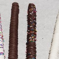 Dipped Pretzel Rods  · Crispy chocolate covered pretzel rods are dipped in chocolate and decorated with drizzle or ...