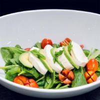 Avocado Caprese Salad · Baby spinach, cherry tomato, fresh mozzarella, basil and avocado.