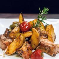 Pork Ribs · Cherry peppers and potatoes in a spicy vinegar and white wine.