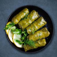 Dolma Appetizer · Fresh grape leaves are stuffed with mix of rice, fresh vegetables and herbs, served chilled ...