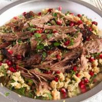 Lamb Shawarma Dinner · Slowly roasted lamb shavings topped with fresh herbs. Served with rice or fries and soup or ...