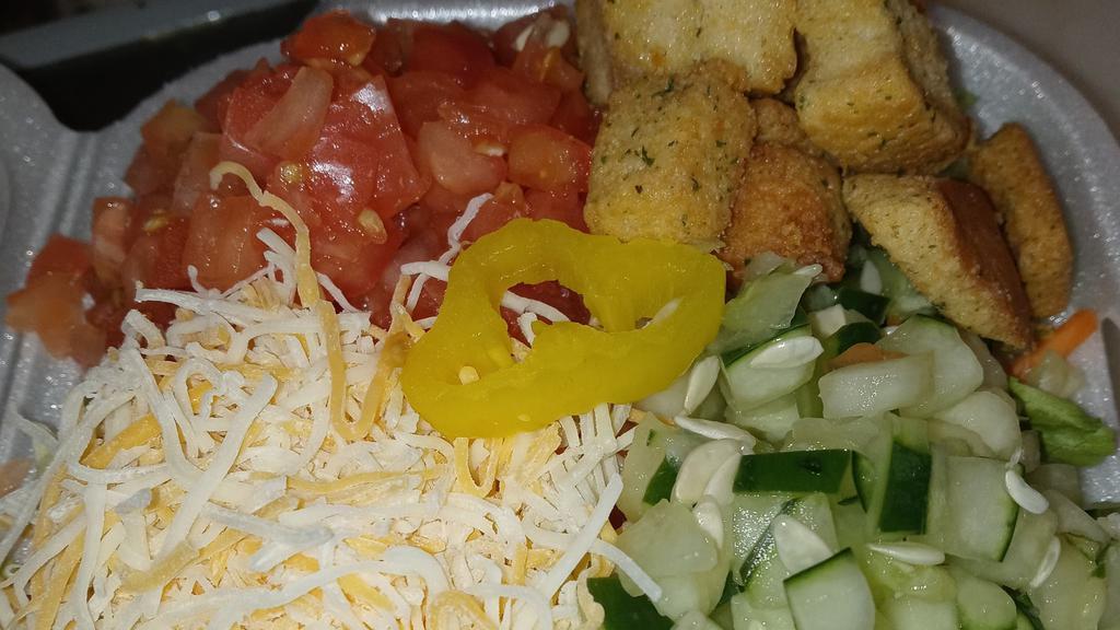 Garden Side Salad · Freshly chopped salad mix with tomato, cucumber, Colby jack cheese and croutons with your choice of dressing!