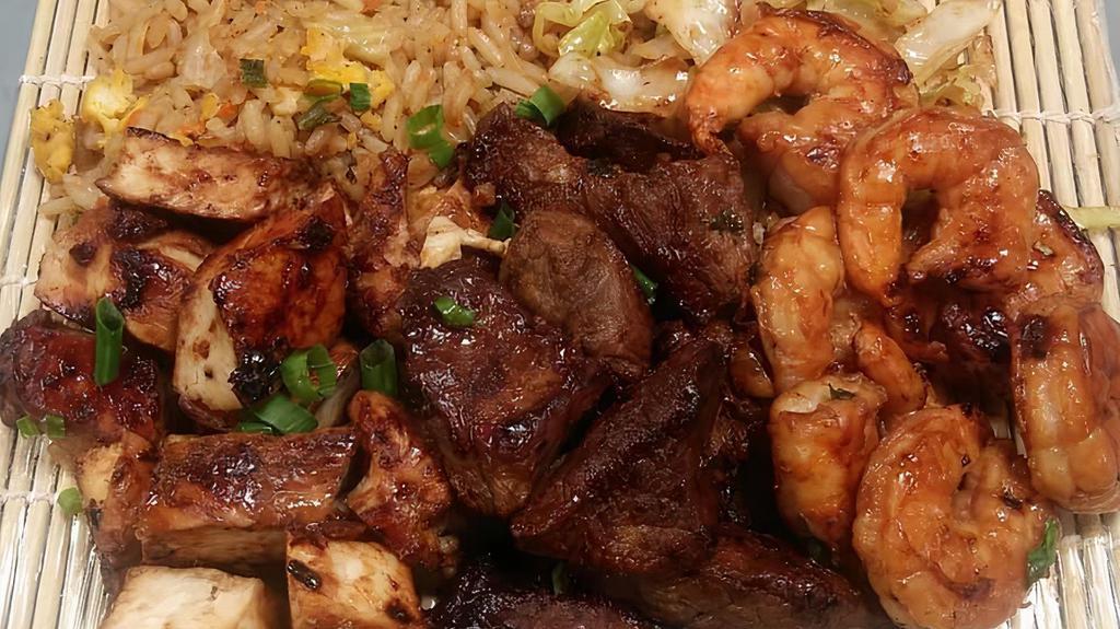Mai Wai Triple Hibachi · Comes with Chicken, Steak and Shrimp, cabbage, one veggie and two sauces!