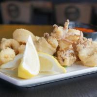 Calamari · Tender calamari, hand tossed & fried to . perfection & served with tequila cocktail sauce. ....