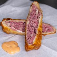 Corned Beef Egg Rolls · stuffed with fresh corned beef and Swiss. served with Russian dressing