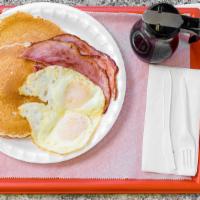 #2. Pancake Special · 3 large pancakes, 2 eggs and choice of ham, 4 bacon strips or 4 sausage links.