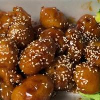 Sesame Chicken (White Meat Chicken) · Chunks of chicken sautéed in special golden sauce with sesame seeds and broccoli on the side.