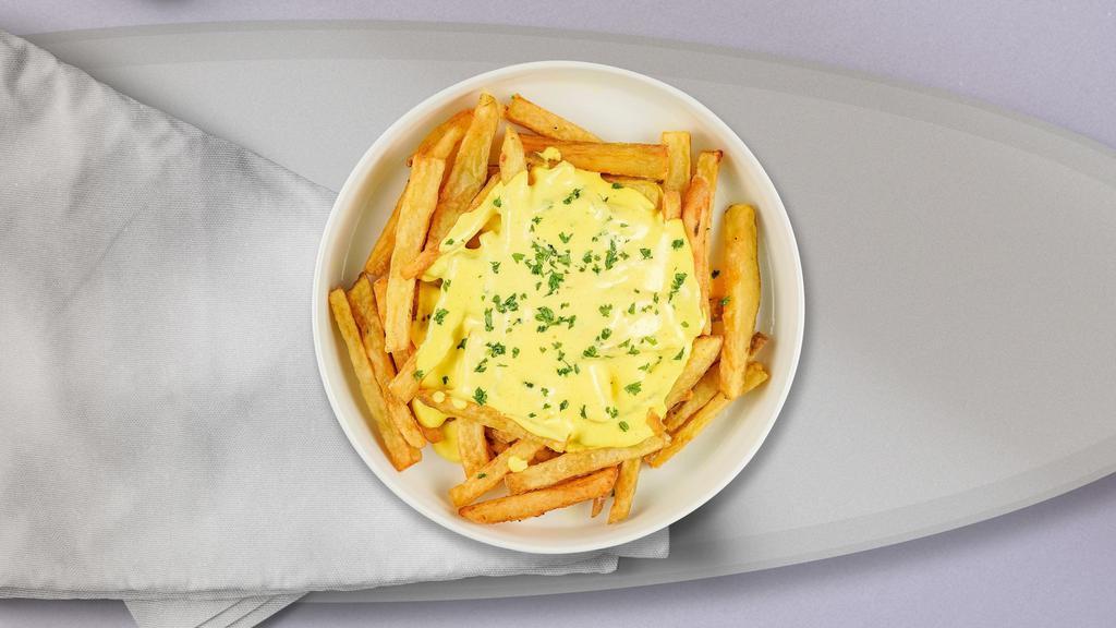 Cheese Theory Fries · Idaho potato fries cooked until golden brown and garnished with salt, melted cheddar cheese, and chili sauce.