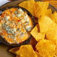 Delena’S Buffalo Chicken Dip · We take slow roasted hand pulled chicken, blend it with our smithwick’s buffalo sauce, cream...