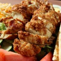 Crispy Chicken Salad · Our crispy chicken breast tenders over fresh romaine lettuce with tomato, cucumber, boiled e...