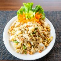 Pineapple Fried Rice · Choice of meat, fried rice with egg, pineapple, cashews, white and green onions, carrots, an...
