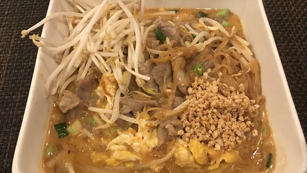 Pad Thai Curry · Choice of meat, stir-fried rice noodles with egg, bean sprouts, and green onions in red curry sauce and topped with crushed peanuts and fresh bean sprouts.