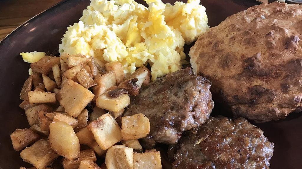 Two Egg Breakfast · Two eggs any style, choice of bacon or house made sausage patty, breakfast potatoes, choice of biscuit or croissant.