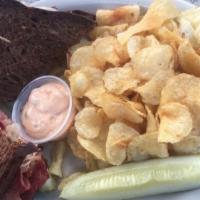 Reuben · Corned beef piled high under melted swiss cheese and sauerkraut, with a side of thousand isl...