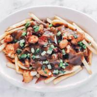 Poutine · French fries tossed in ranch seasoning, topped with cheese curds, beef gravy, green onions a...