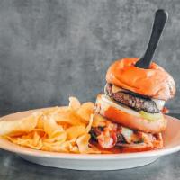 Hogg Attack Burger · Two Hand pattied burgers layered and smothered in a hoggsbreath comeback sauce, topped with ...