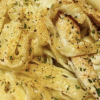 Blackened Chicken Alfredo · Tender strips of fresh grilled chicken served with a kick, over a bed of fettuccine noodles,...