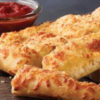 16 Piece Cheezybread · Fresh-baked bread strips with our 3-cheese blend and garlic butter, served with a side of pi...