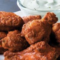 15 Piece Chicken Wings · Order of 15 big and meaty chicken wings served classic Buffalo style or tangy BBQ style (2 s...