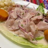 Ceviche · Fresh fish marinated with lemon, onion, spicy pepper, and cilantro. Served with boiled corn,...