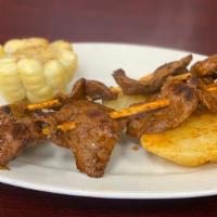 Anticuchos De Corazon De Res · Meat marinaded (Cow heart), skewered and. and seaved over the grill. Served with potato, and...