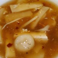 Hot & Sour Soup · Spicy. Tofu, bamboo shoot, water chestnut and egg in a tangy hot and sour broth.