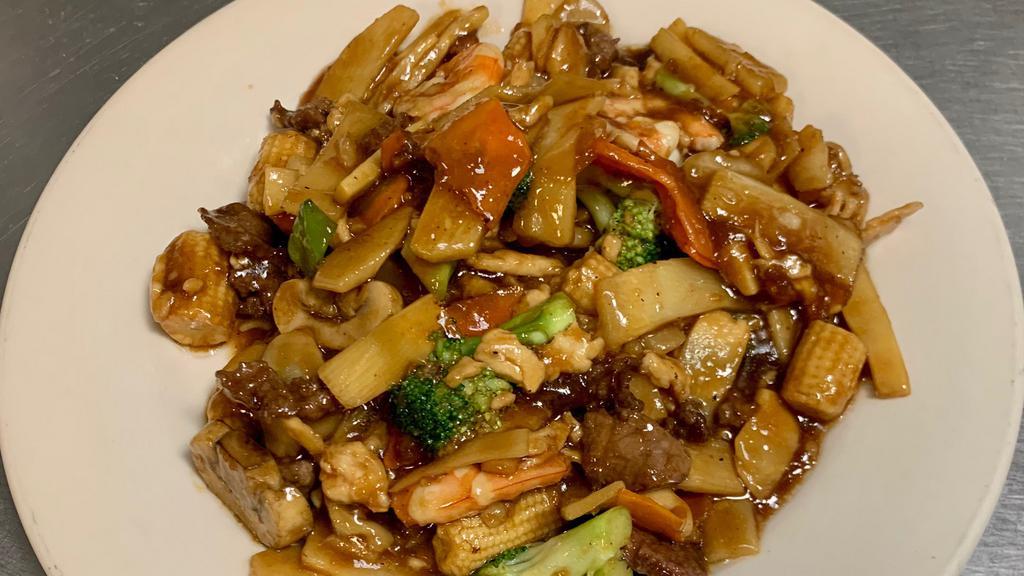Triple Delight · Shrimp, chicken and beef stir fry with broccoli, water chestnut, mushroom, bamboo shoot and snow peas in a delicious brown sauce.