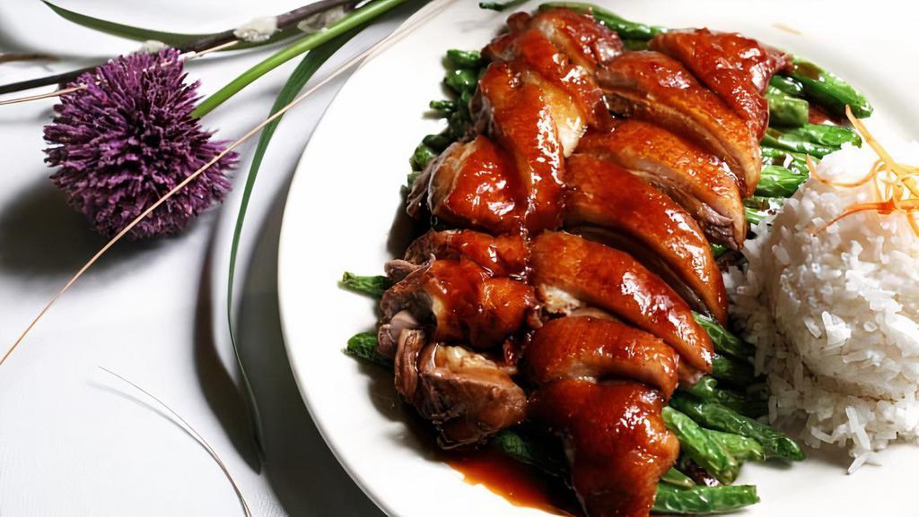 Roast Duck With Green Beans · Tender roasted duck breast served on top of fresh green beans and chef’s specialty brown sauce.