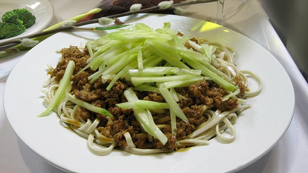 Beijing Noodles · Spicy. Warm, spicy and sweet minced pork sauce over wheat noodles, topped with shredded cucumbers and scallions.