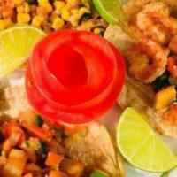 Shrimp Fajitas · Served with rice, beans, sour cream, and guacamole.