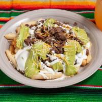 Carne Asada Fries · Steak and French fries, cheese topped, sour cream, guacamole.